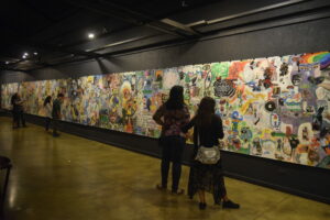 2 people viewing an indoor wall mural